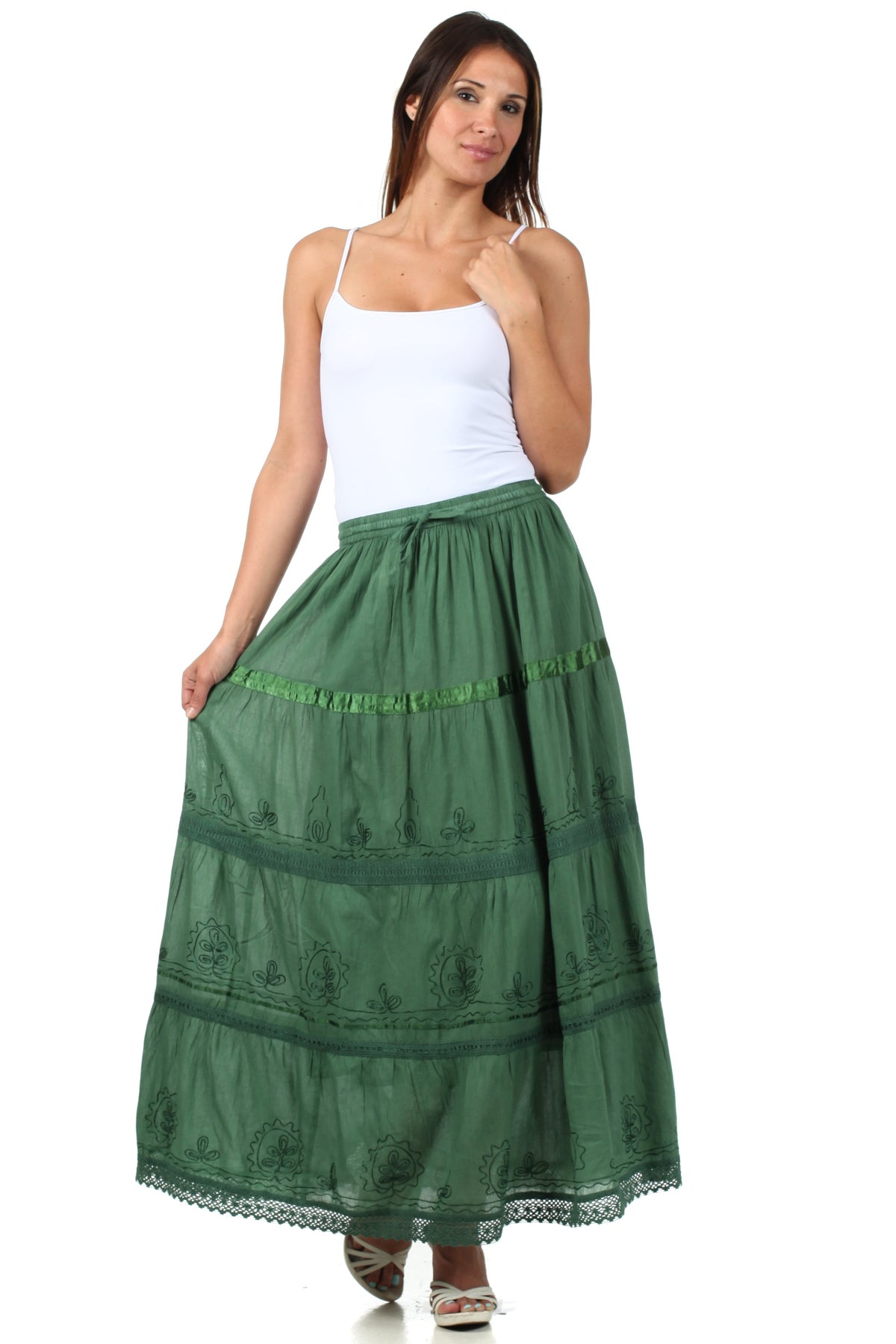 Green tiered cotton skirt with smocked waistband, stitched detailing, and lace hem