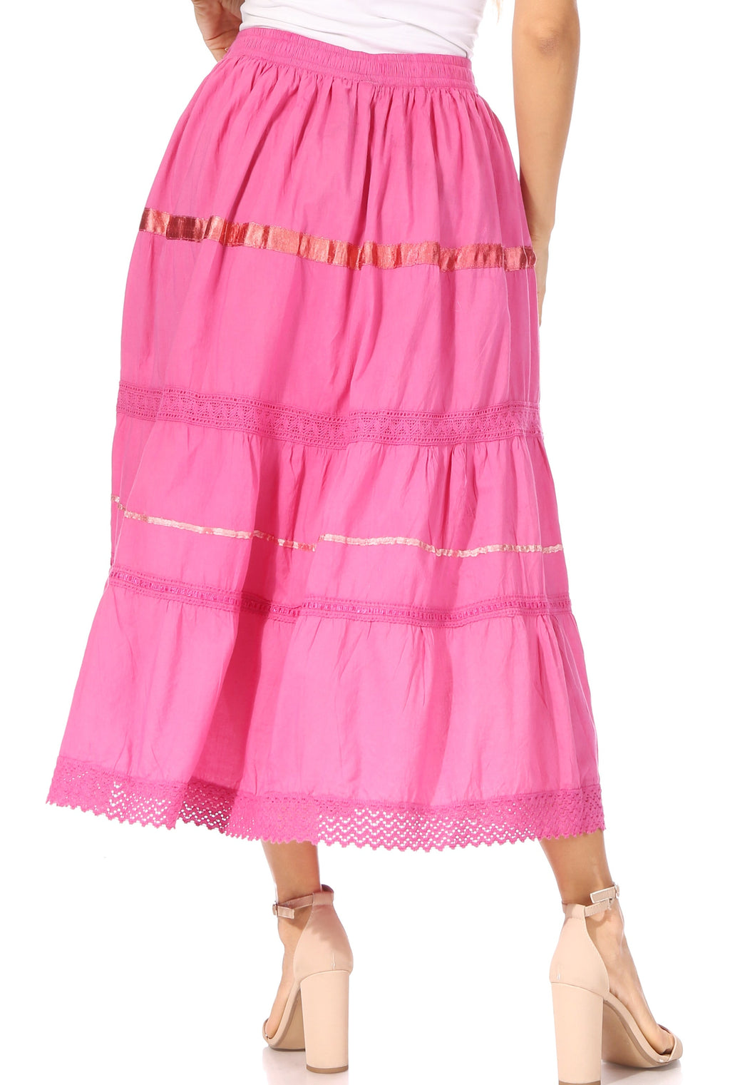 Pink tiered maxi skirt with gold stripe bands, embroidered texture, and lace trim hem