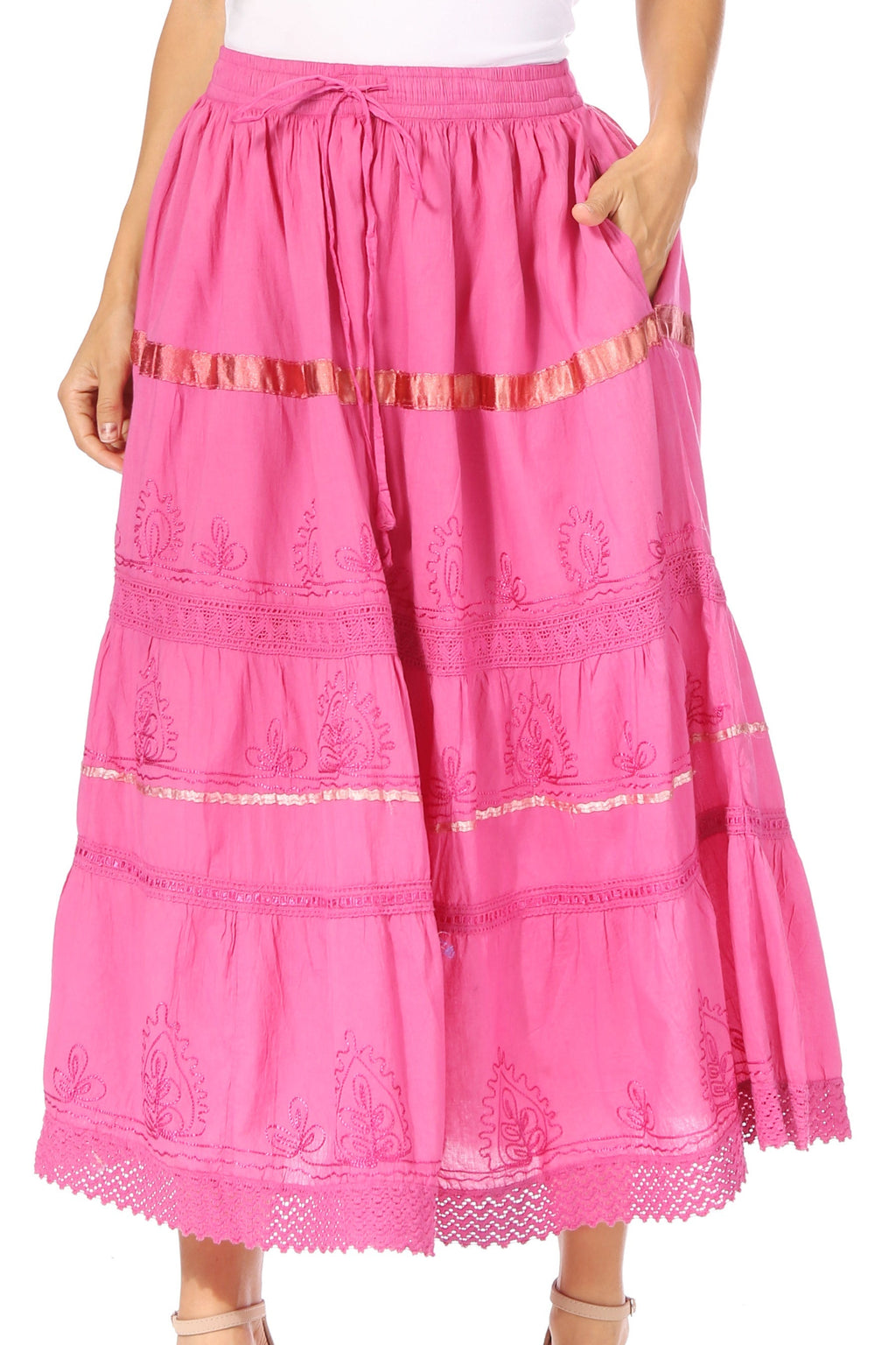 Pink tiered maxi skirt with elastic waist, embroidered panels, and lace trim hem