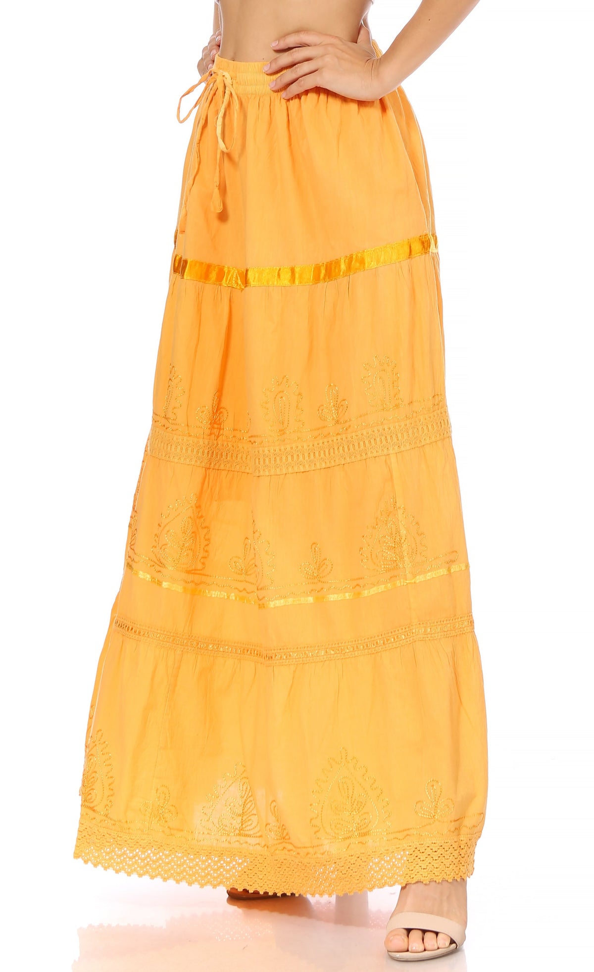 Orange tiered maxi skirt with elastic waist and embroidered bands; lace hem