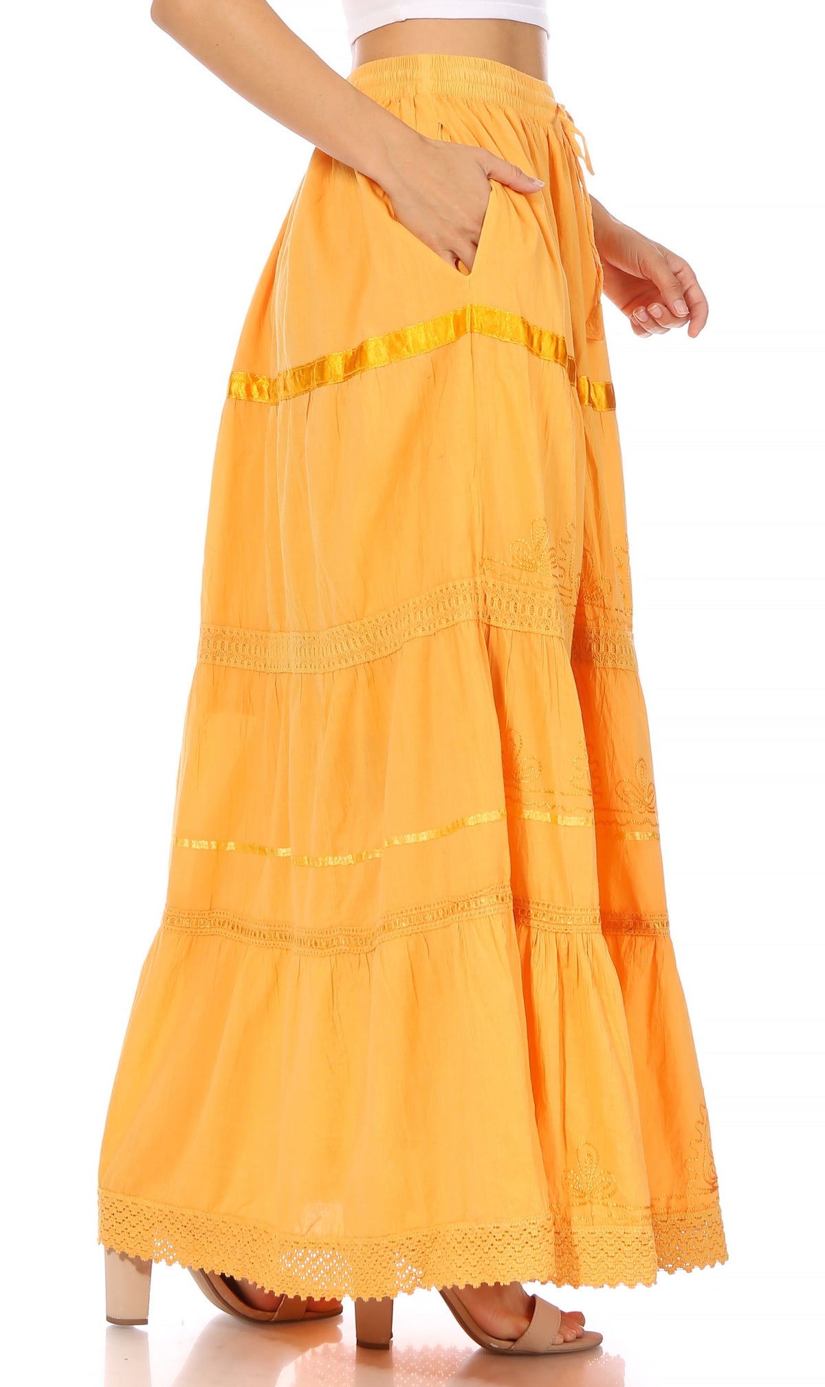 Orange tiered cotton maxi skirt with gold trim bands and lace-hem finish