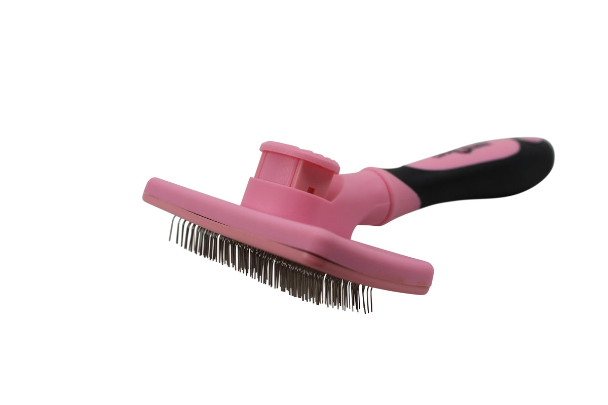 Pet slicker brush with pink comb head, black handle, and steel bristles for grooming