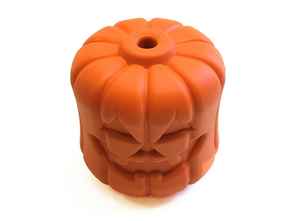 Orange jack-o'-lantern dog chew toy with carved face and round treat hole