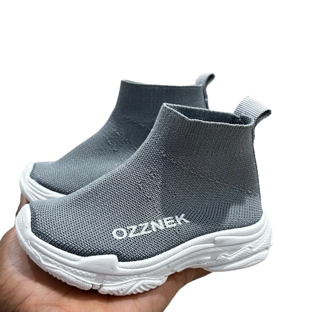 Kids slip-on sneakers, light grey knit upper with white sole and raised side stitching