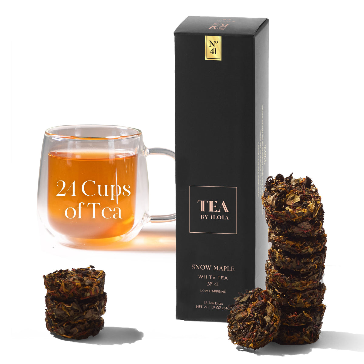 Snow Maple No. 41 tea box and discs beside a glass of brewed tea