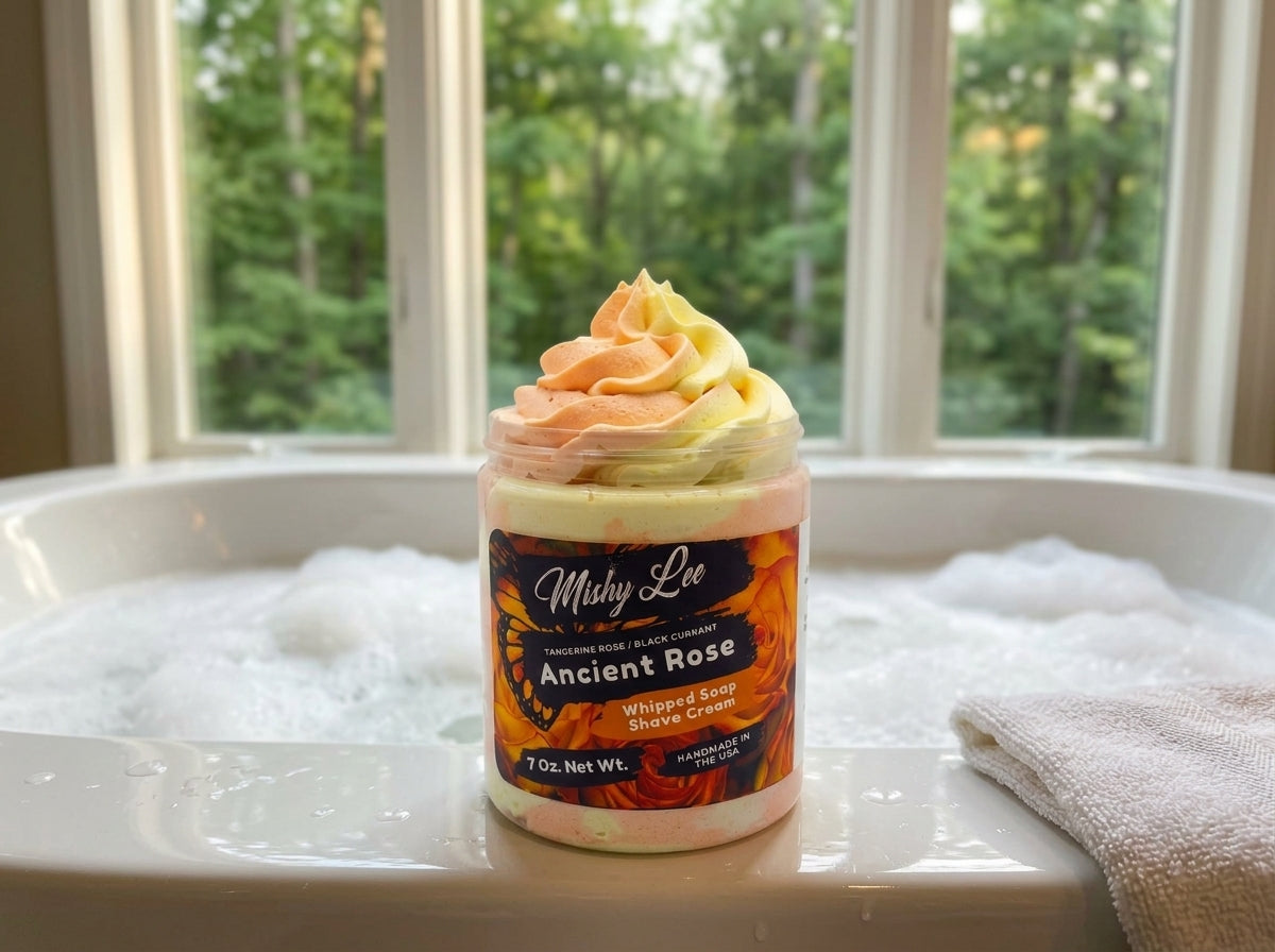 Whipped soap and shave cream jar on bathtub water with orange and yellow swirl