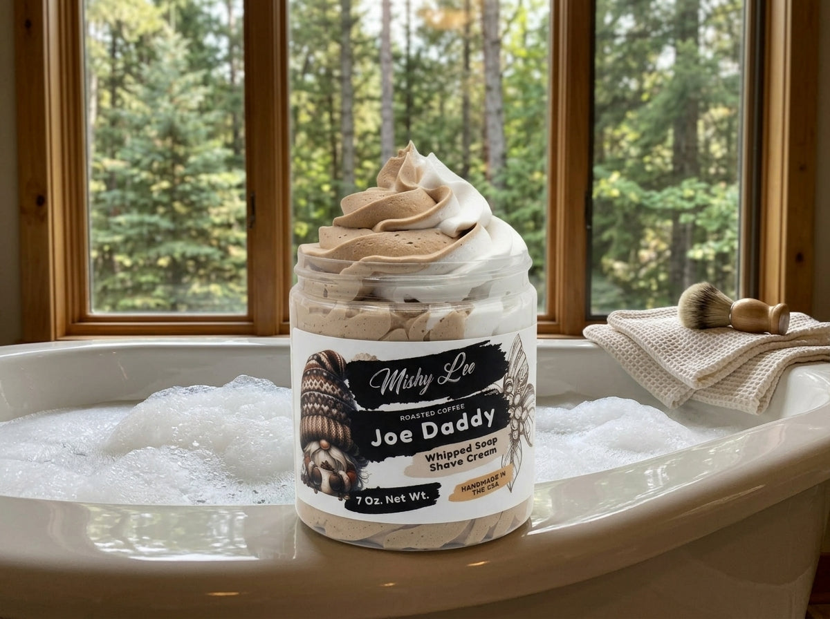 Whipped soap and shave cream jar on bathtub ledge with whipped swirls