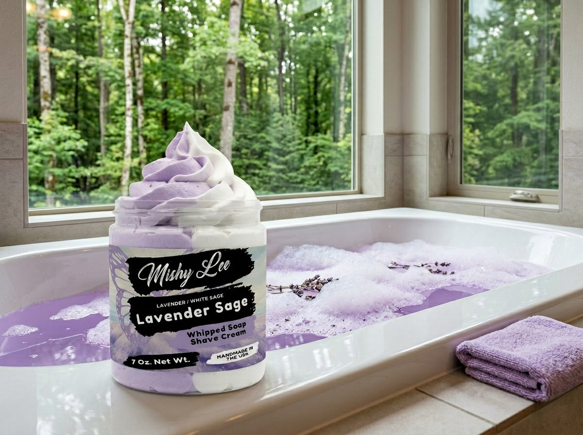 Lavender Sage whipped soap and shave cream jar beside a bathtub with folded towel