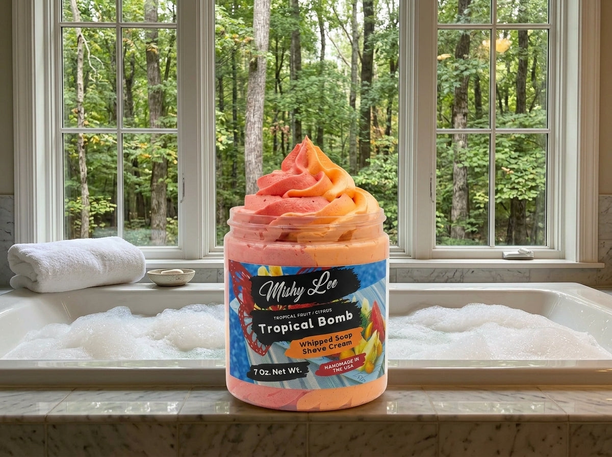 Whipped soap and shave cream jar with pink-orange swirl on a bathtub ledge