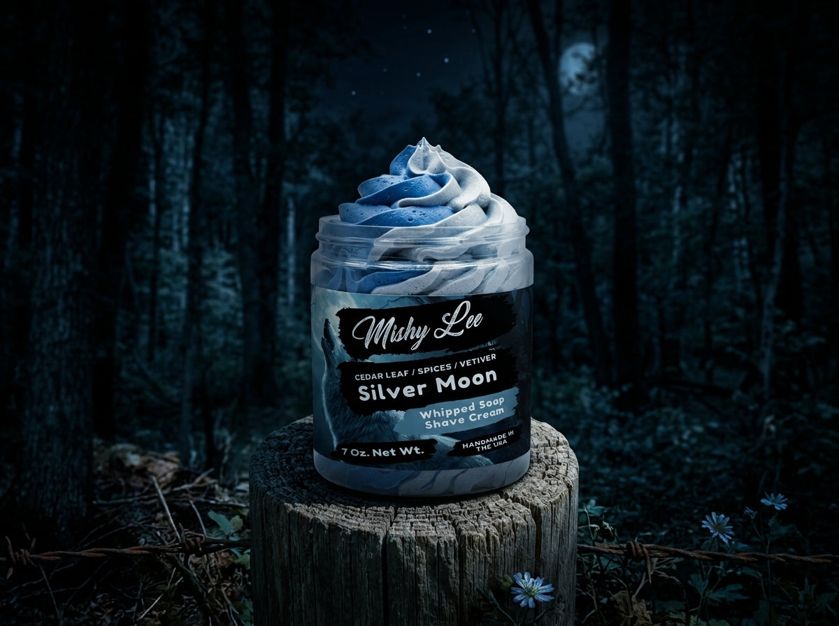 Mushy Lee Silver Moon whipped soap and shave cream jar on a dark outdoor log