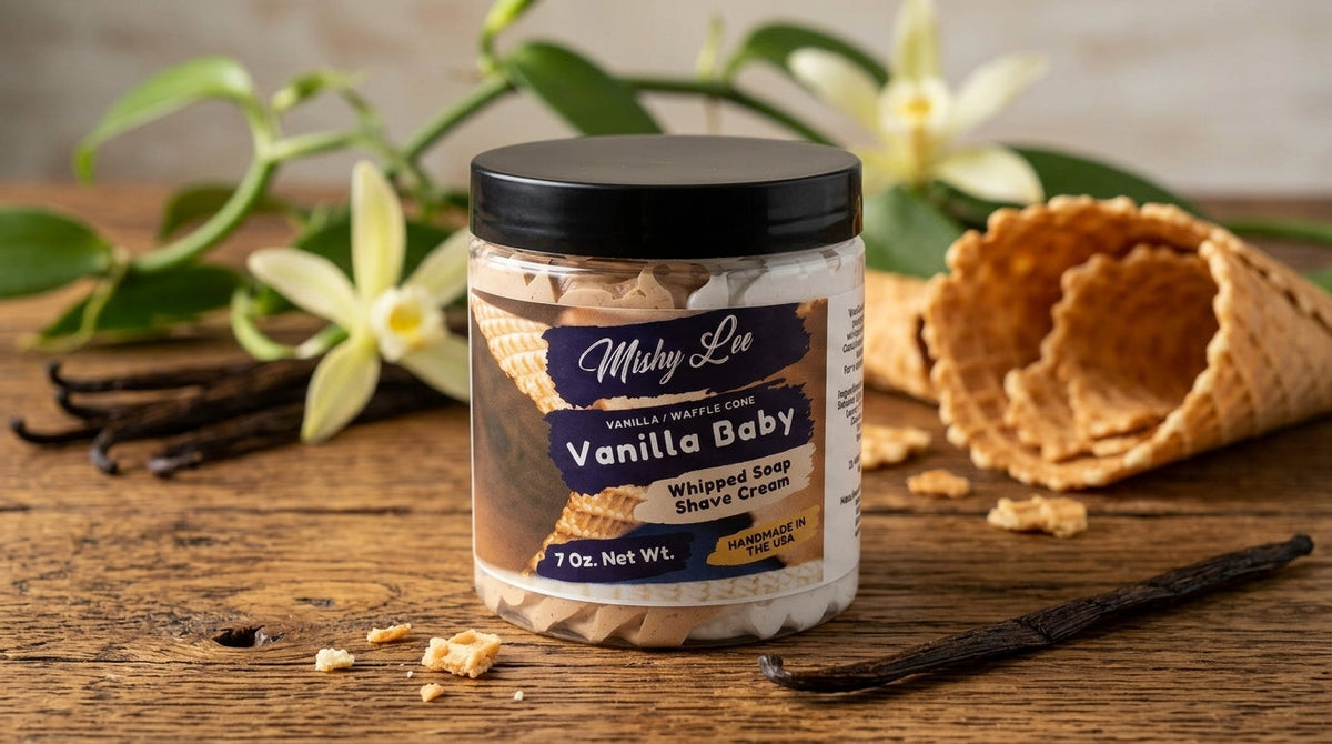 Vanilla baby whipped soap and shave cream jar with black lid and vanilla swirls