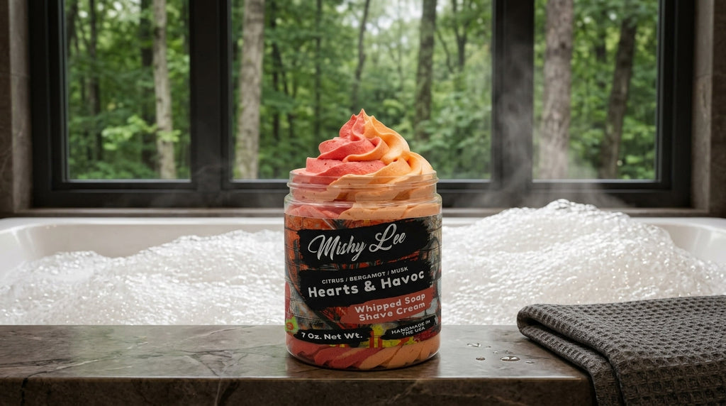 Whipped soap and shave cream jar on countertop with white foam, Hearts & Havoc label