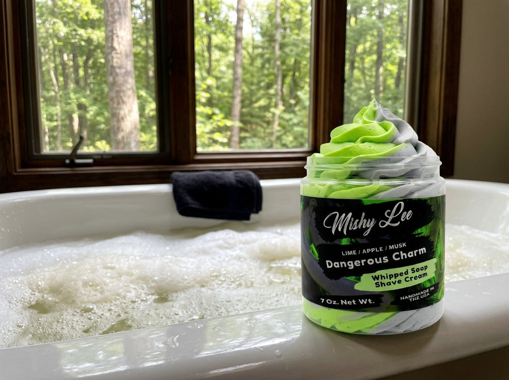 Whipped soap and shave cream jar beside bath water and soap sponge