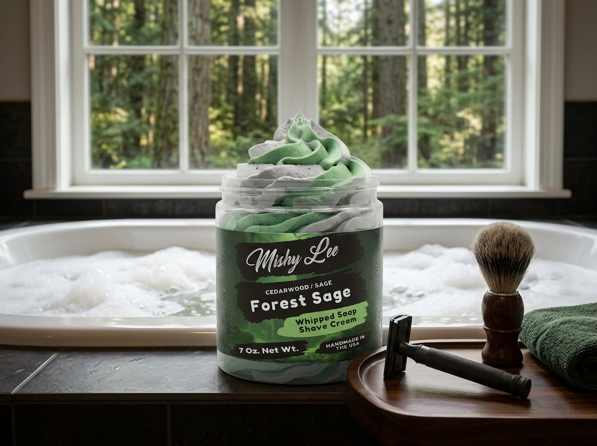 Whipped soap and shave cream jar with green foam swirls by a sink and window