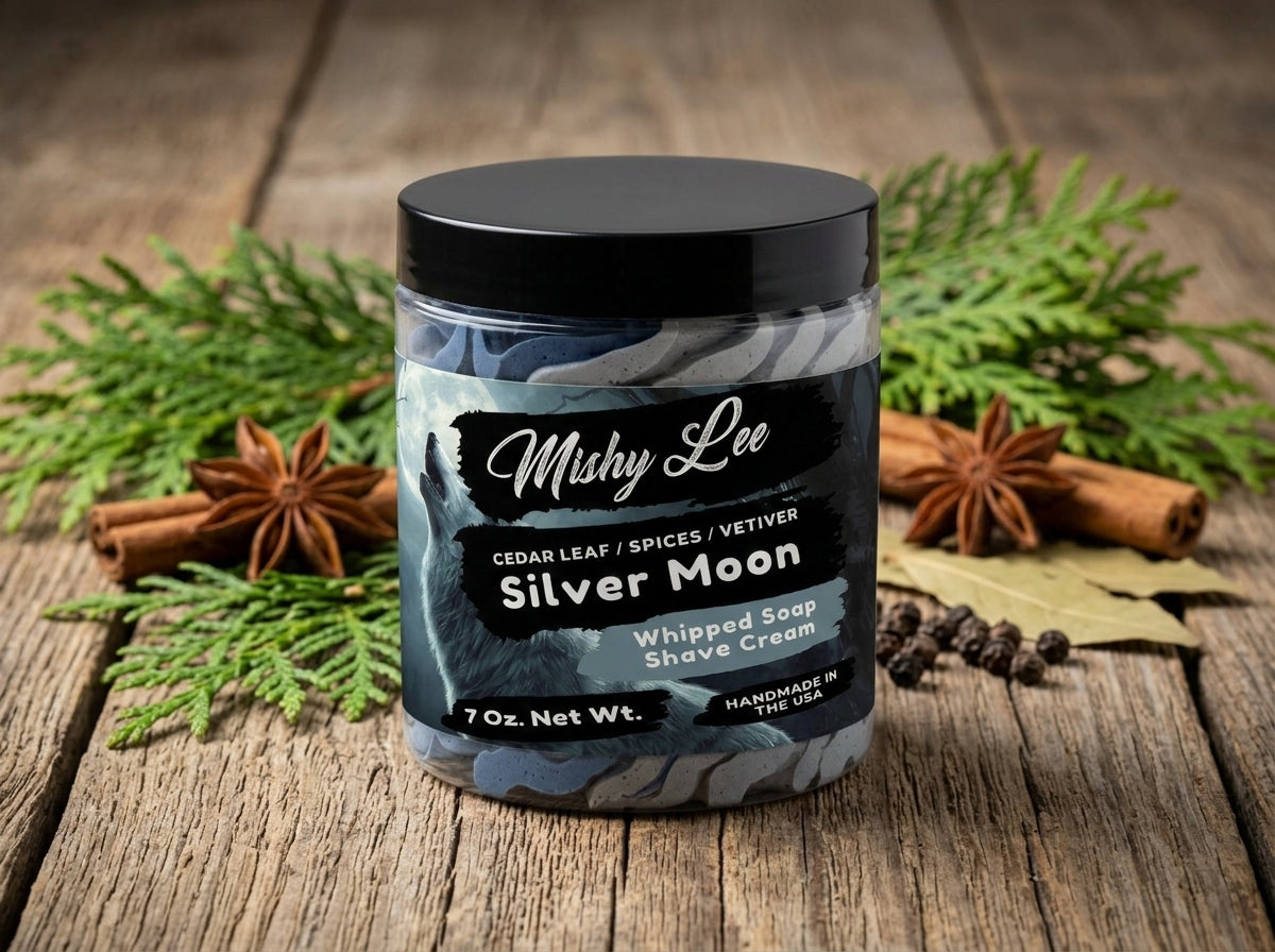 Jar of Mushy Lee Silver Moon whipped soap and shave cream on wooden surface