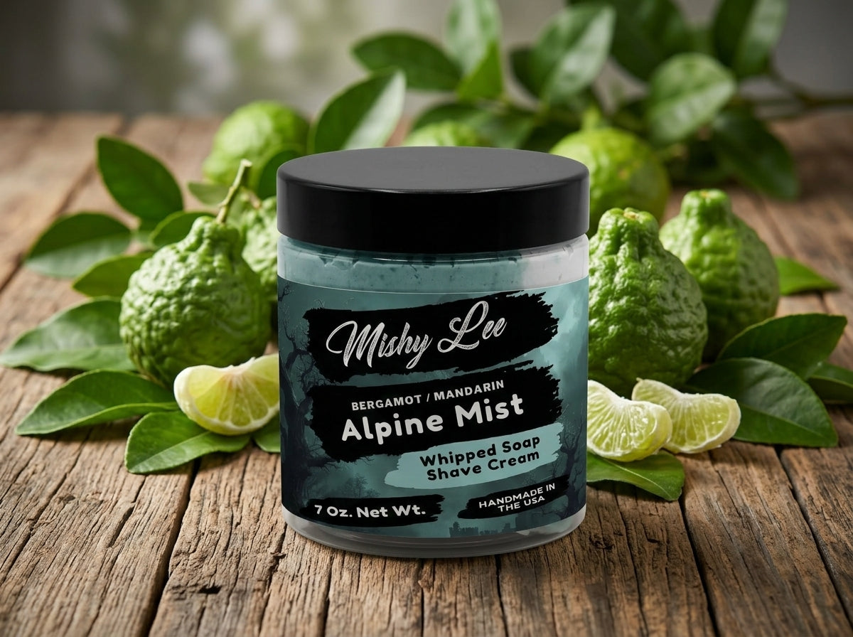 Men’s whipped soap and shave cream jar with black lid on wooden surface with citrus.