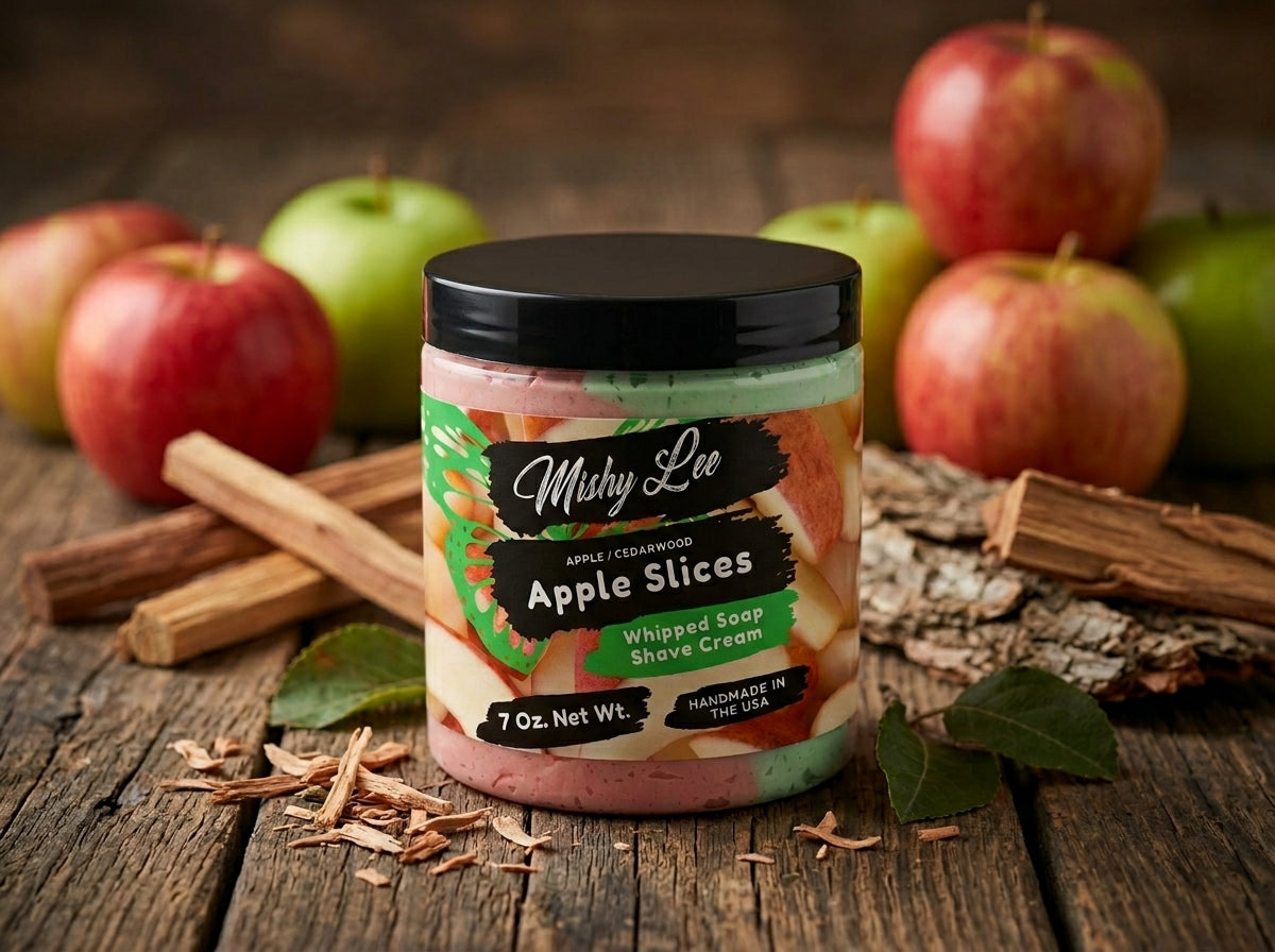 Whipped soap and shave cream jar on wooden surface with apples and cinnamon sticks