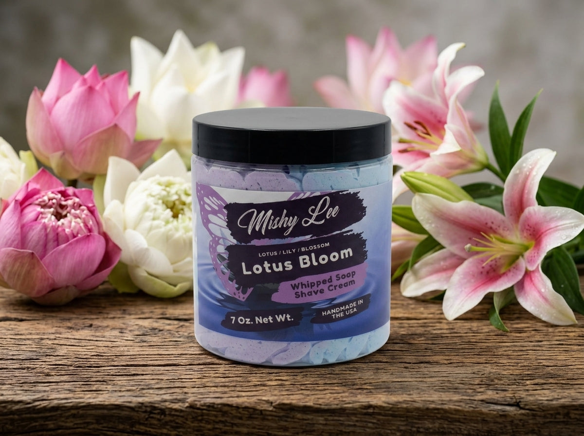Lotus Bloom whipped soap and shave cream jar with black lid on wooden table
