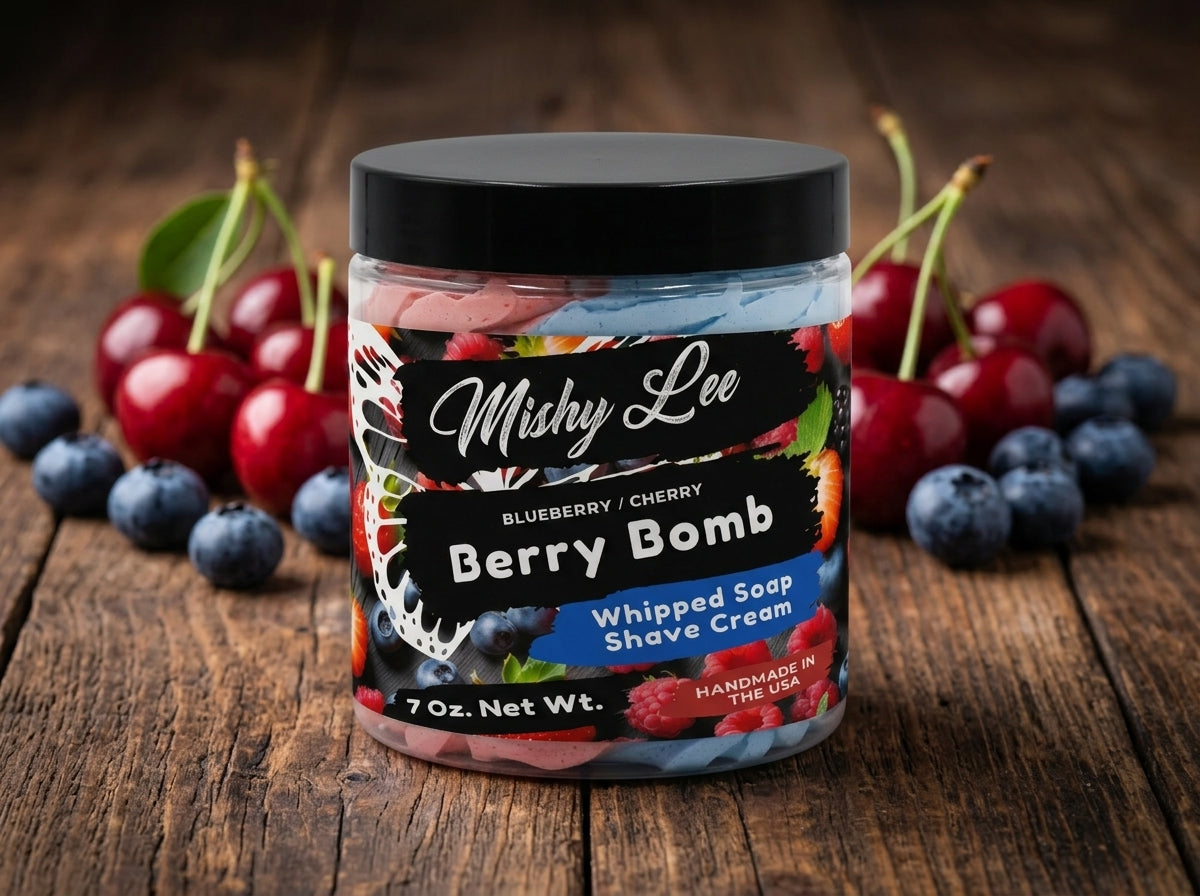 Whipped soap and shave cream jar labeled Berry Bomb, with pink and blue swirls