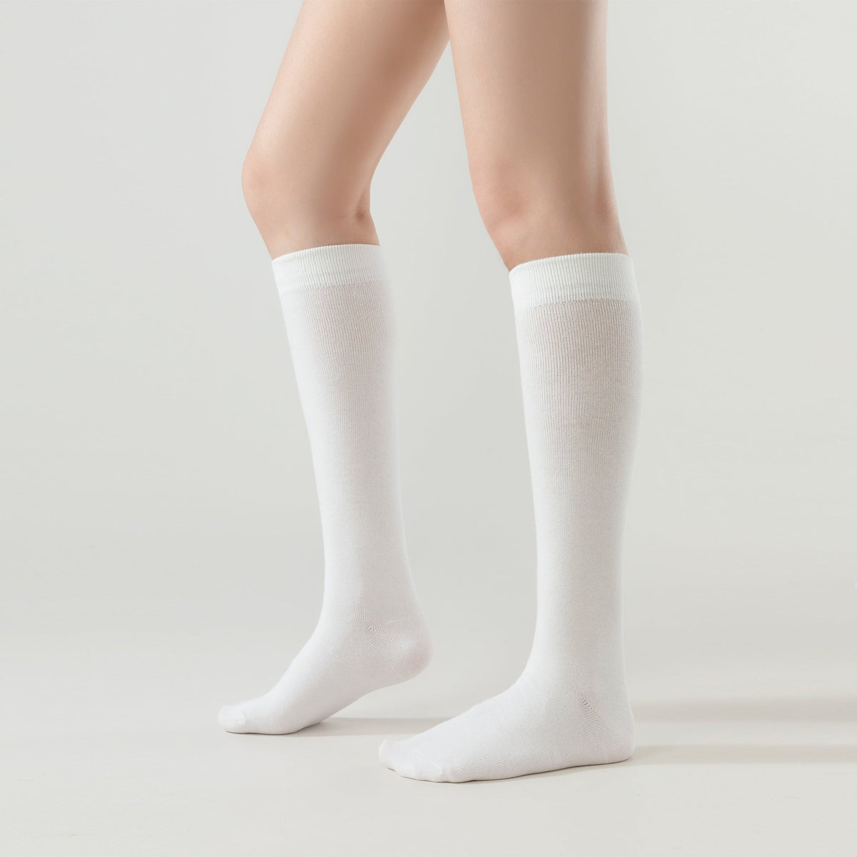 Cream white crew socks, side view with ribbed cuffs