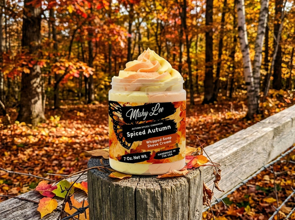 Whipped soap and shave cream jar outdoors on wood with fallen autumn leaves