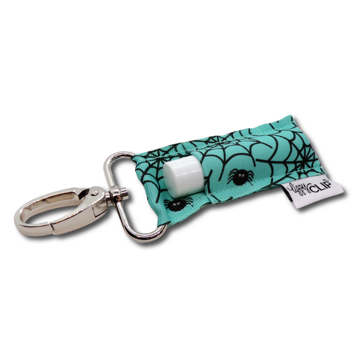 Teal spiderweb-pattern lip balm holder clip with white balm tube