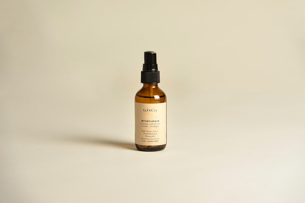 Amber scented spray bottle with black mist pump