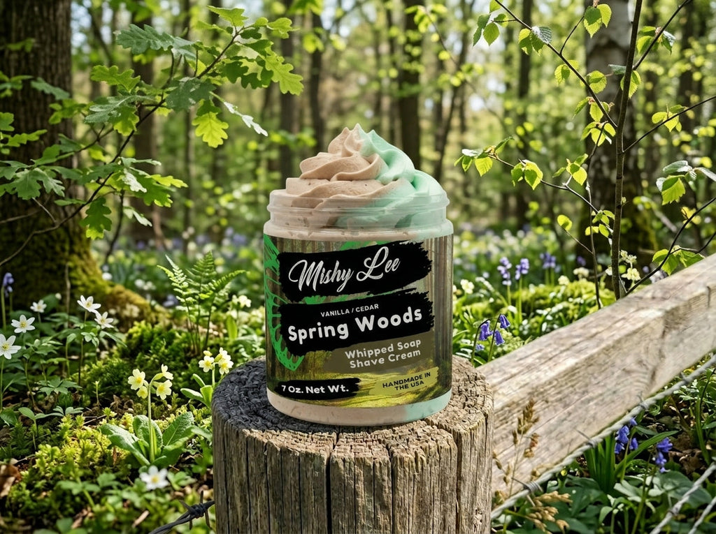 Mishy Lee Spring Woods whipped soap and shave cream jar on a stump in a garden
