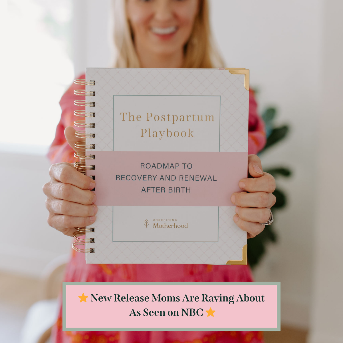 Postpartum planner book with spiral binding; cover title The Postpartum Playbook