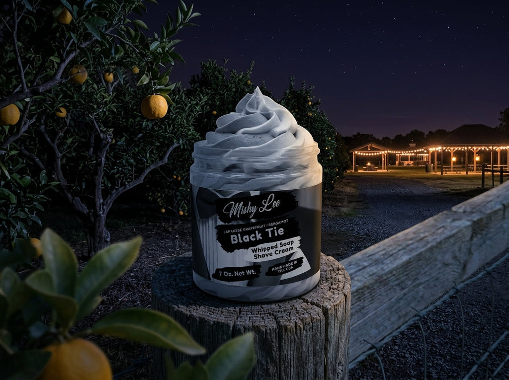 Whipped soap and shave cream jar with gray foam swirls, Black Tie label outdoors