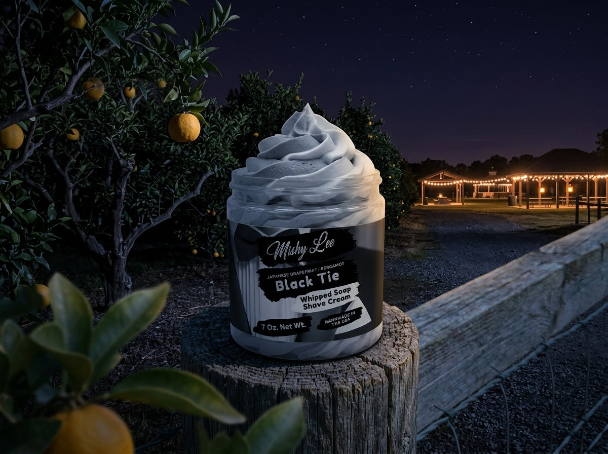 Whipped soap and shave cream jar with gray foam swirls, Black Tie label outdoors