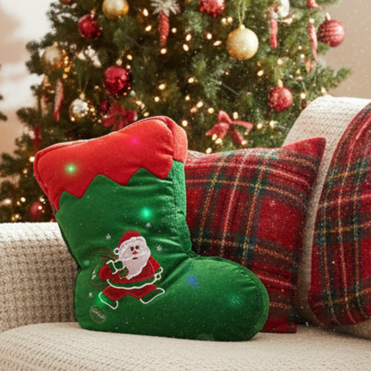 Close-up green plush LED stocking throw pillow with Santa applique and red top