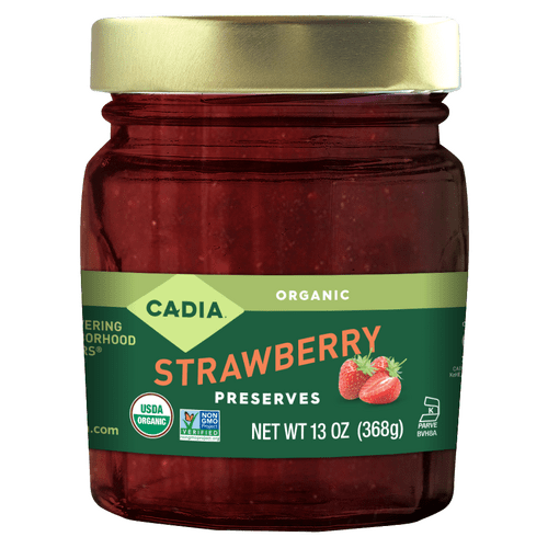 Jar of organic strawberry preserves with green lid, Cadia label, 13 oz