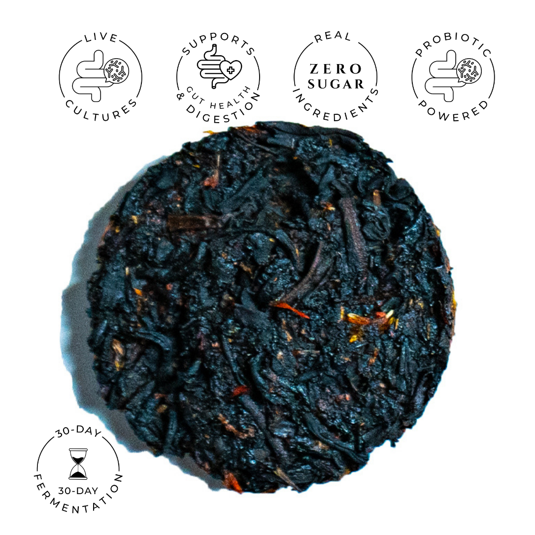 Round compressed Strawberry Seduction black tea disc with visible tea leaves and fruit flecks