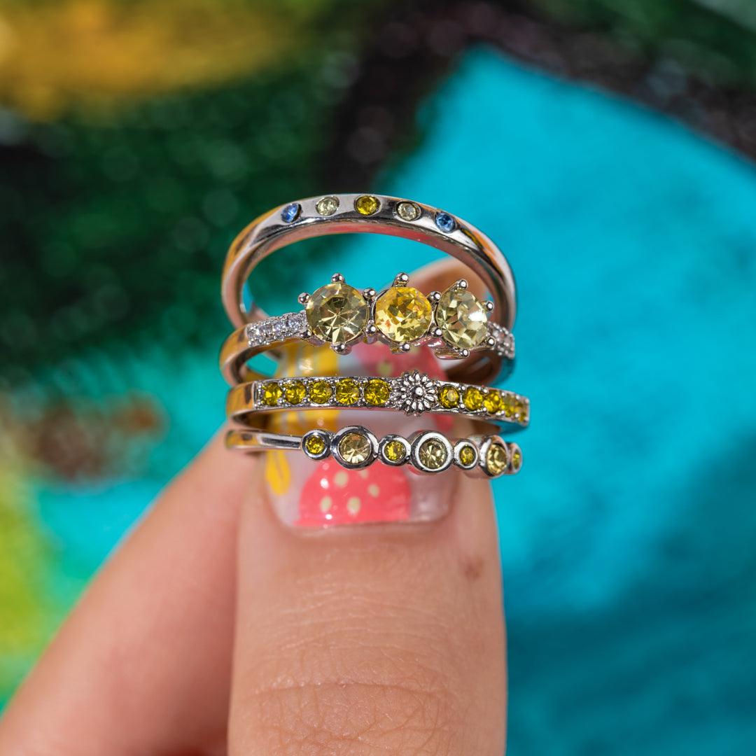 Goldtone ring set with oval golden center stone and multicolor crystal bands