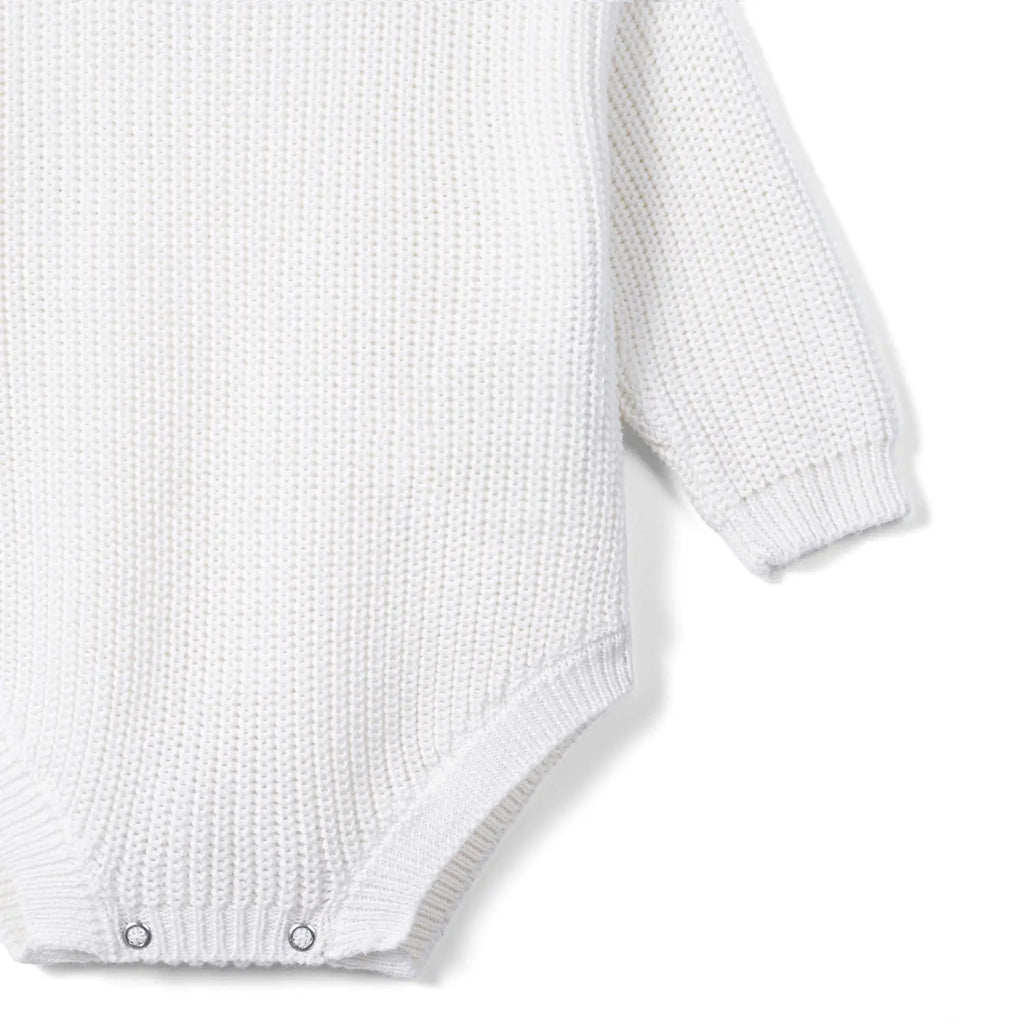 White chunky knit baby romper with long sleeve and snap-button hem