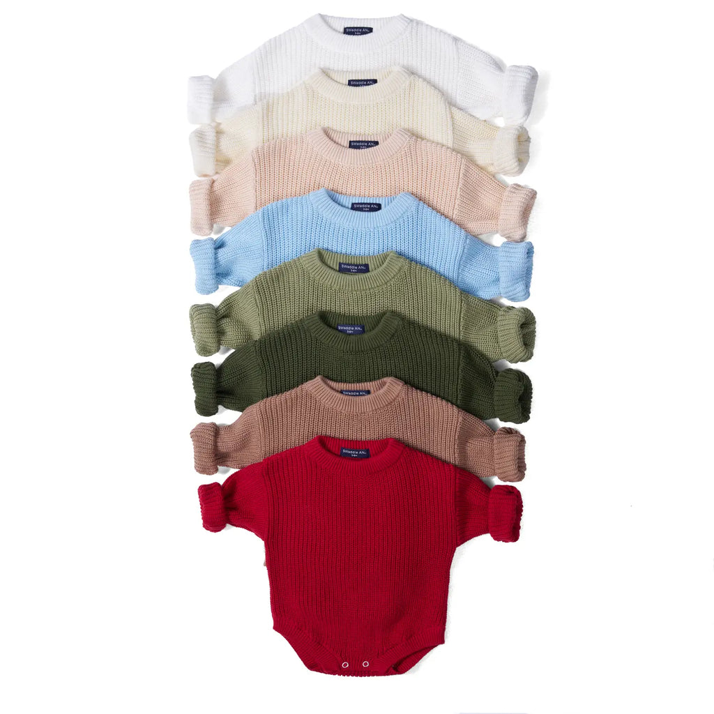 Knit baby romper set in white, cream, blue, green, tan and red with long sleeves.