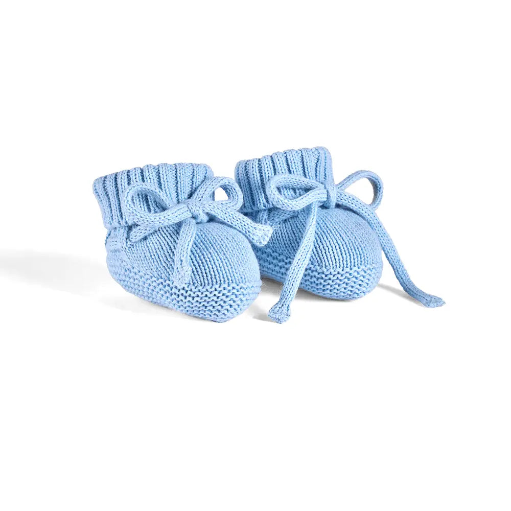 Baby blue knitted baby booties with drawstring ties and cuffed opening