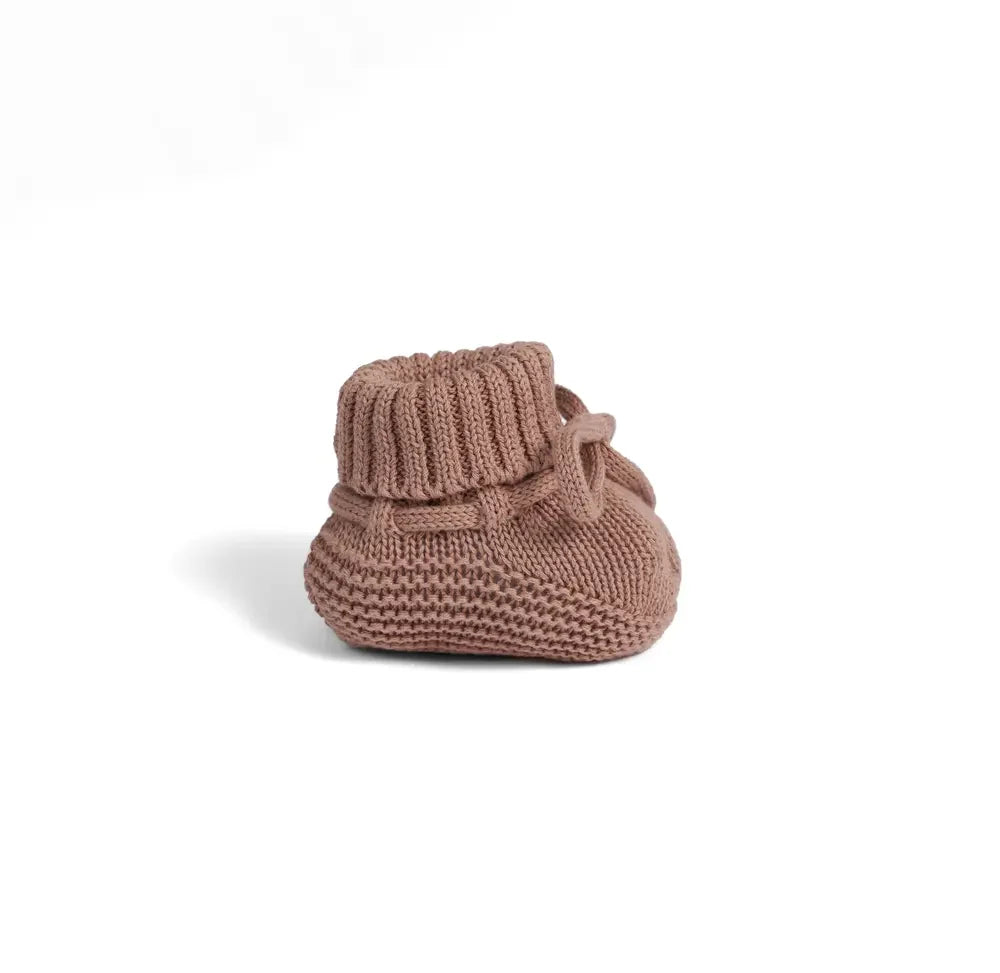 Mocha knitted baby bootie side view with ribbed cuff and bow tie