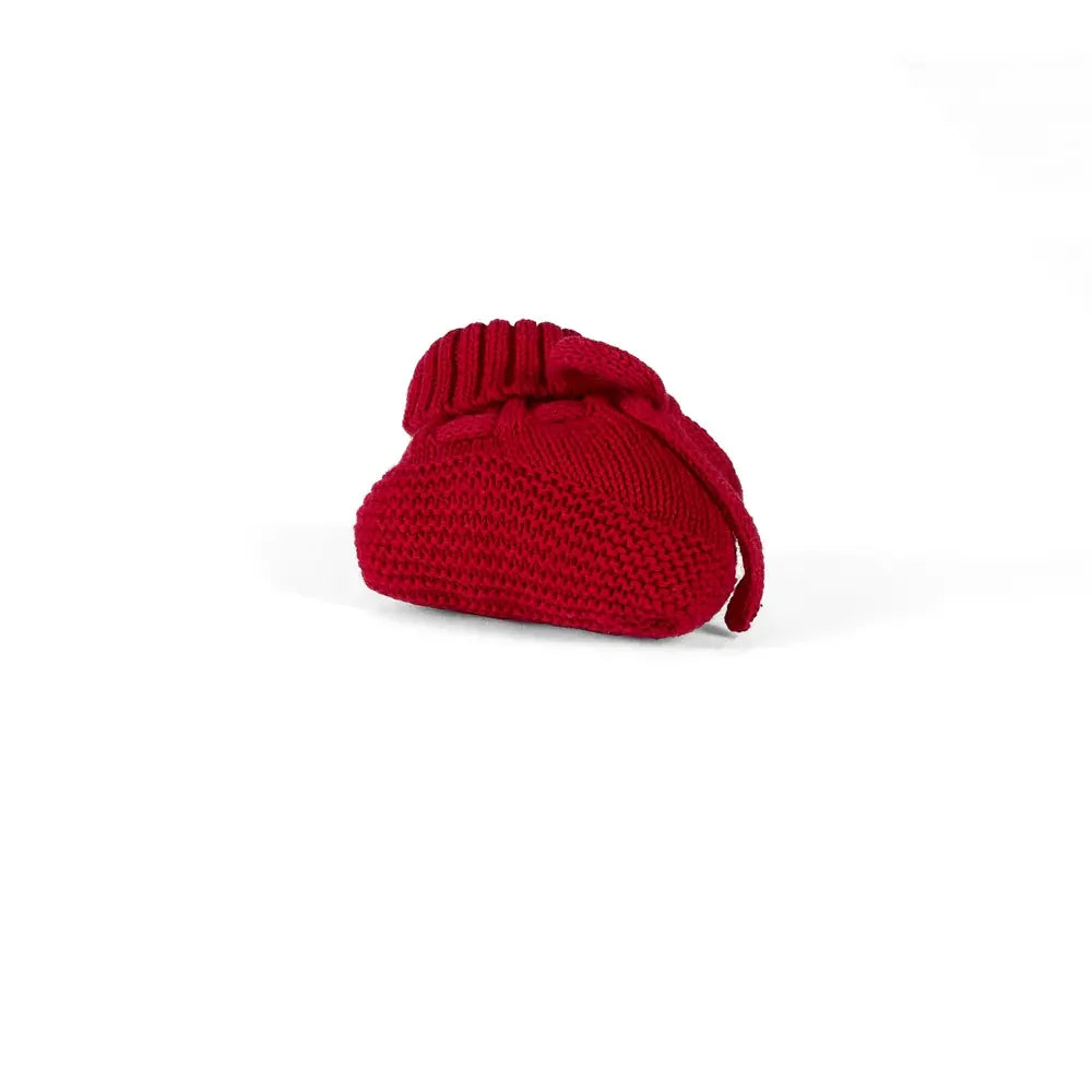 Red knitted baby bootie with ribbed cuff and small bow tie