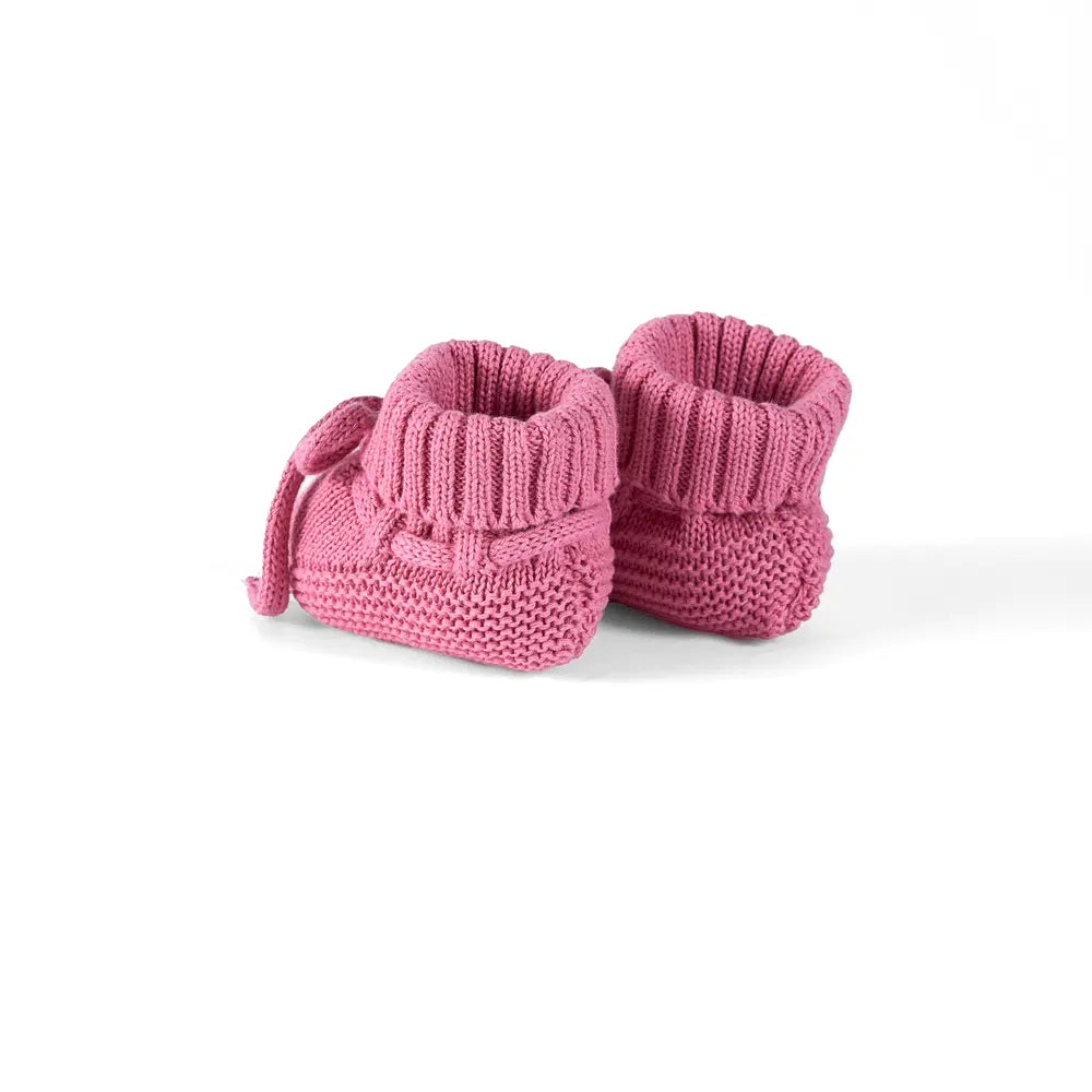 Rose pink knitted baby booties, side view with lace ties