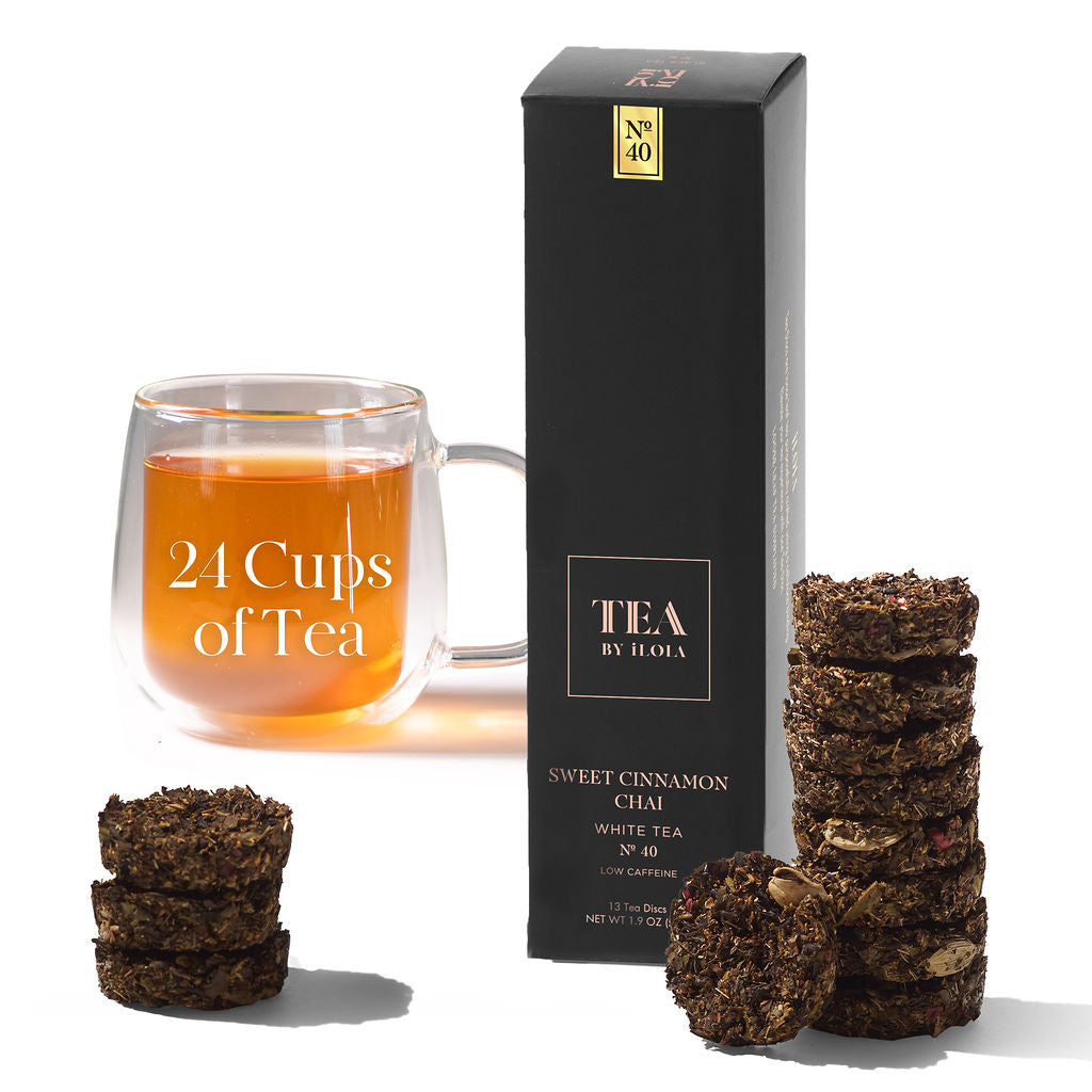 Sweet Cinnamon Chai tea box with a cup of tea and stacked discs