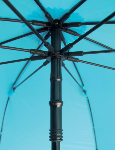 Trekking umbrella close-up of blue canopy ribs and central hub