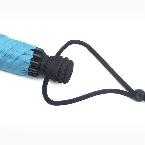 Trekking umbrella handle with black strap and blue canopy fabric edge