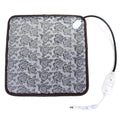 Gray heated pet blanket with rose pattern, brown edge trim, and power cord