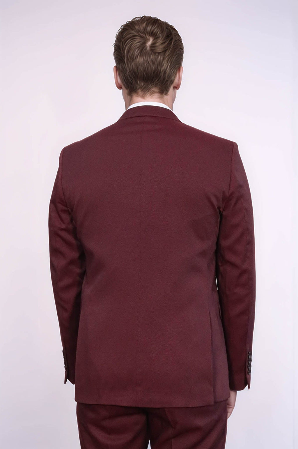 Burgundy suit jacket back view with slim trousers and vest underneath