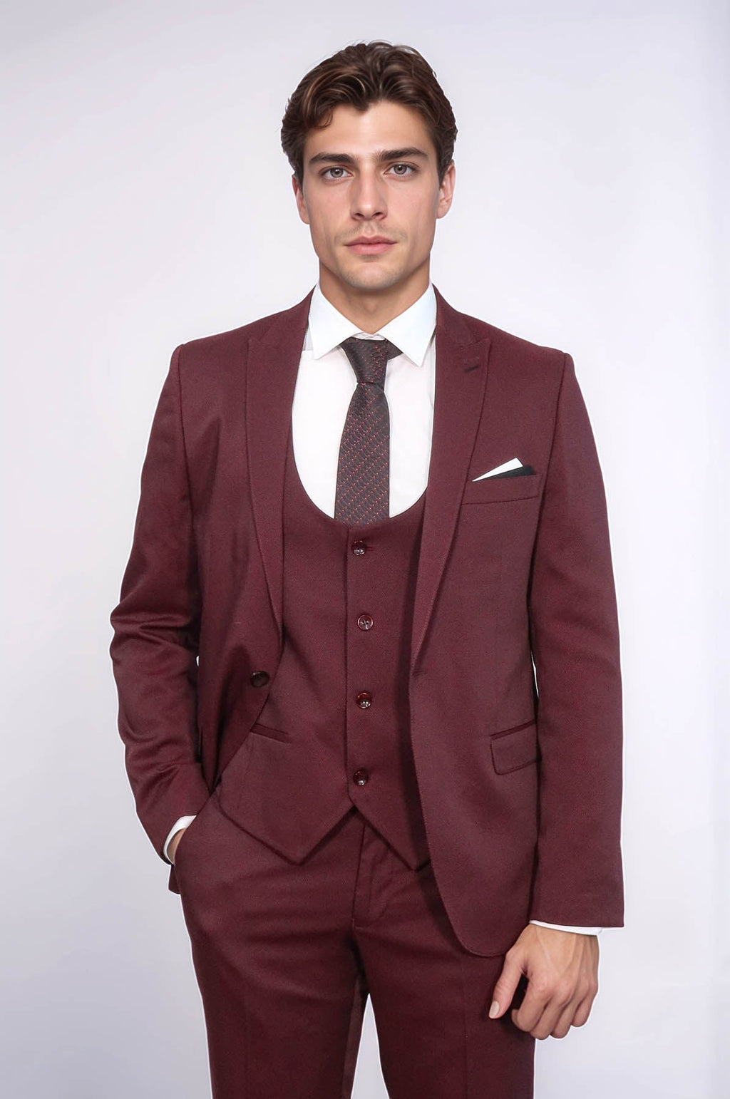 Burgundy three-piece vested suit with jacket, waistcoat, tie, and pocket square