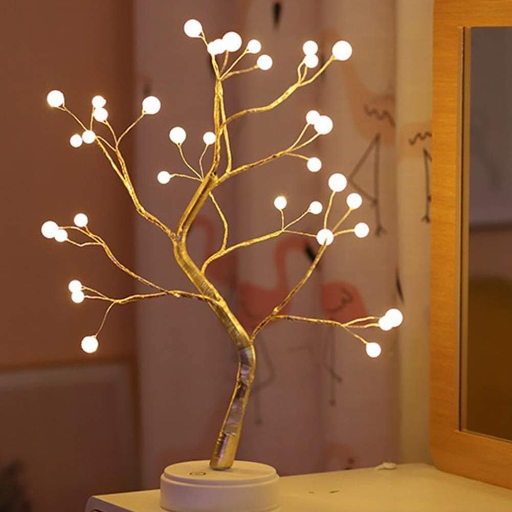 Warm white LED tree lights with glowing bulb heads on branching stems, battery base.