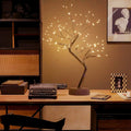 Warm white LED light tree on round base, battery-powered