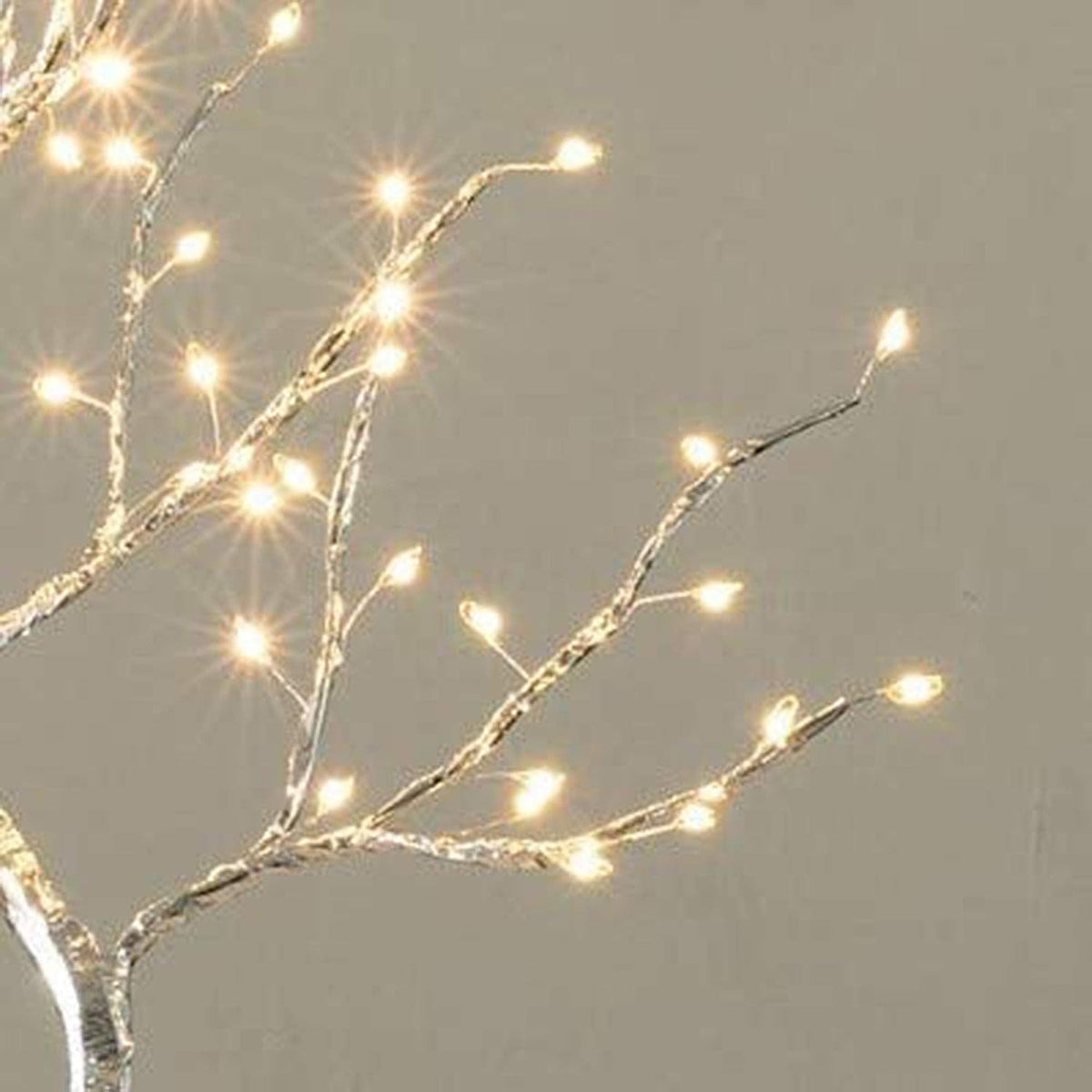 Close-up of warm white LED bulbs on branching light tree